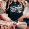 Out Here Trusting The Lord | Christian T-Shirt | Ruby’s Rubbish® -Ruby's Rubbish OuthereTrustingtheLord Black web